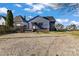 Back of home with gravel and grass yard and an entrance to the house at 126 E Henderson St, Salisbury, NC 28144