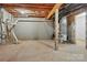 Unfinished basement with visible insulation and ductwork, offering potential for customization at 1282 Kindness Nw Ct, Concord, NC 28027