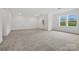 Spacious bonus room featuring plush carpeting, neutral paint, and a pair of double hung windows at 1282 Kindness Nw Ct, Concord, NC 28027