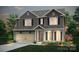 Charming two-story home featuring a two-car garage, brick accents, and a beautifully landscaped front yard at 1282 Kindness Nw Ct, Concord, NC 28027
