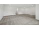 Spacious living room with neutral color palette and plush carpeting at 1282 Kindness Nw Ct, Concord, NC 28027
