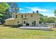 Backyard featuring a two-story home with a deck that walks out to the large lush lawn at 1308 Spring Lake Dr, Gastonia, NC 28054