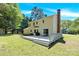 This lush backyard features a large deck perfect for entertaining at 1308 Spring Lake Dr, Gastonia, NC 28054