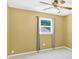 Cozy bedroom with light-colored carpet, a ceiling fan, and a window with gray curtains at 1308 Spring Lake Dr, Gastonia, NC 28054