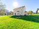 Spacious backyard with lush lawn and mature trees, ideal for outdoor enjoyment at 14802 Rolling Sky Dr, Charlotte, NC 28273