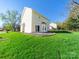 Lush backyard featuring a well-maintained lawn and mature trees that offers tranquility at 14802 Rolling Sky Dr, Charlotte, NC 28273