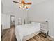Spacious bedroom featuring a ceiling fan, hardwood floors, and neutral walls at 14802 Rolling Sky Dr, Charlotte, NC 28273