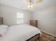 Bedroom with ceiling fan, natural light, and wood floors at 14802 Rolling Sky Dr, Charlotte, NC 28273