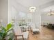 Cozy breakfast nook bathed in sunlight with view to dining room and kitchen at 14802 Rolling Sky Dr, Charlotte, NC 28273