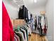 Walk-in closet with built-in shelving and hanging rods at 14802 Rolling Sky Dr, Charlotte, NC 28273