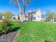 Charming two-story home featuring blue shutters, brick accents, and a well-manicured lawn on a sunny day at 14802 Rolling Sky Dr, Charlotte, NC 28273