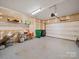 Spacious garage with overhead lighting, door opener, and ample room for storage at 14802 Rolling Sky Dr, Charlotte, NC 28273