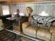 Bright living room with booth dining area, comfortable seating, and decorative throw pillows at 149 Deer Park Rd # D26/27, Mount Gilead, NC 27306