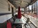 Cozy patio featuring a ceiling fan, shade umbrella, table, and chairs at 149 Deer Park Rd # D26/27, Mount Gilead, NC 27306
