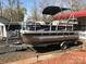 Well-maintained pontoon boat on a trailer, ready for lake adventures and Gathering fun at 149 Deer Park Rd # D26/27, Mount Gilead, NC 27306