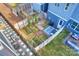Charming fenced backyard featuring a patio area, garden beds, and lush greenery at 1651 Duckworth Ave, Charlotte, NC 28208