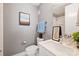 Stylish bathroom features a modern vanity, sleek fixtures, and a framed painting with a tiled shower, creating a spa-like retreat at 1651 Duckworth Ave, Charlotte, NC 28208