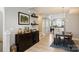 Dining room leading to the kitchen with a bar and an access to the living room at 1651 Duckworth Ave, Charlotte, NC 28208