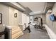 Basement gym with exercise bike, weight machine, and TV, creating the perfect space to achieve your fitness goals at home at 1651 Duckworth Ave, Charlotte, NC 28208