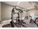 Home gym featuring a full weight machine, free weights, and an exercise bike, providing comprehensive fitness options at 1651 Duckworth Ave, Charlotte, NC 28208