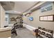 Well-equipped home gym with varied workout equipment, including free weights, perfect for maintaining an active lifestyle at 1651 Duckworth Ave, Charlotte, NC 28208