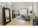 Bright living room showcasing modern decor, hardwood floors, and large mirror at 1651 Duckworth Ave, Charlotte, NC 28208