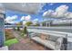 Inviting rooftop deck with comfortable sofa, string lights, and vibrant potted plants at 1651 Duckworth Ave, Charlotte, NC 28208
