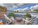 This rooftop deck offers a cozy outdoor lounge space with a firepit area at 1651 Duckworth Ave, Charlotte, NC 28208