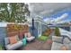 Stylish rooftop deck with lounge seating, wooden flooring, and a lush garden area at 1651 Duckworth Ave, Charlotte, NC 28208