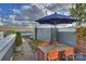 The rooftop deck offers plenty of seating with an outdoor dining table at 1651 Duckworth Ave, Charlotte, NC 28208