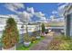 Serene rooftop deck with lush landscaping, string lights, and comfortable seating at 1651 Duckworth Ave, Charlotte, NC 28208