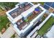 A rooftop patio with seating, dining space, and greenery, creating a private outdoor oasis at 1651 Duckworth Ave, Charlotte, NC 28208
