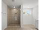 The bathroom features a walk-in shower with glass doors at 2022 Puddle Pond Rd, Indian Trail, NC 28079