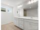 Bathroom showcases a double vanity with white cabinets at 2022 Puddle Pond Rd, Indian Trail, NC 28079