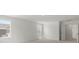 Bright bedroom with neutral walls, soft carpeting, and windows offering ample natural light at 2022 Puddle Pond Rd, Indian Trail, NC 28079