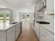 This kitchen showcases stainless steel appliances, including a gas range, and beautiful views of the outdoors at 2022 Puddle Pond Rd, Indian Trail, NC 28079