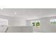 Bright loft area with multiple windows offering scenic views of the surrounding neighborhood at 2022 Puddle Pond Rd, Indian Trail, NC 28079