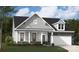 Charming single-Gathering home featuring a stone facade, gray siding, and a two-car garage at 2041 Mantle Ridge Dr, Indian Trail, NC 28079