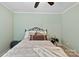 Cozy bedroom with a black metal bed frame, plush bedding, and natural light creates a relaxing retreat at 207 N Sims St, Kings Mountain, NC 28086