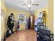 Eclectic bedroom with yellow walls, hardwood floors, and unique decor offers a creative and vibrant space at 207 N Sims St, Kings Mountain, NC 28086