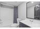 Bathroom with a white sink, dark blue vanity, and bathtub with shower at 2154 Withers Dr, Maiden, NC 28650