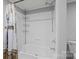 Clean bathroom featuring a white tiled shower and useful shelving at 2154 Withers Dr, Maiden, NC 28650
