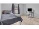 Bedroom with a bed, desk, chair, television, and wood-look flooring at 2154 Withers Dr, Maiden, NC 28650
