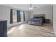 Spacious bedroom filled with natural light, featuring a wooden bed and light gray walls at 2154 Withers Dr, Maiden, NC 28650