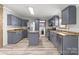 Well-equipped kitchen with stainless steel appliances, center island, and wood countertop at 2154 Withers Dr, Maiden, NC 28650