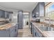 Spacious kitchen with grey cabinets, stainless steel appliances, and wood countertop at 2154 Withers Dr, Maiden, NC 28650