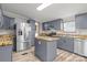 Modern kitchen featuring stainless steel appliances, kitchen island, and wood countertop at 2154 Withers Dr, Maiden, NC 28650