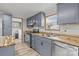 Functional kitchen with grey cabinets, stainless steel appliances, and wood countertop at 2154 Withers Dr, Maiden, NC 28650