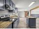 Well-lit kitchen featuring stainless steel appliances, an island and wood countertops at 2154 Withers Dr, Maiden, NC 28650