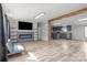 Bright living room with electric fireplace and open view to kitchen and dining area at 2154 Withers Dr, Maiden, NC 28650